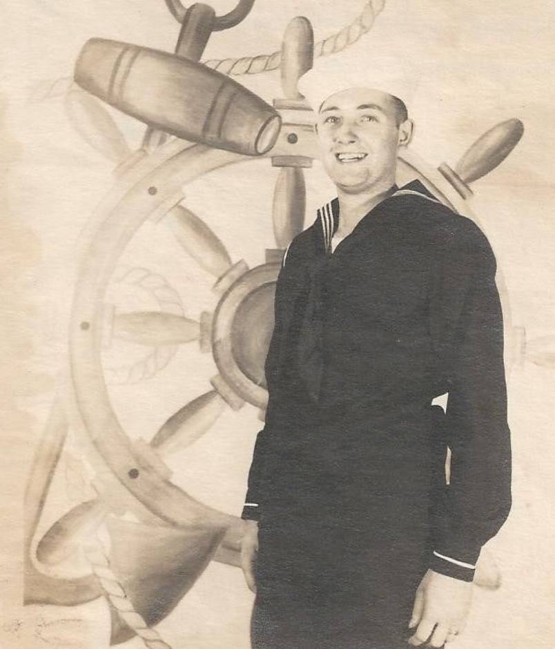 Edward Smith in front of anchor USS Arizona